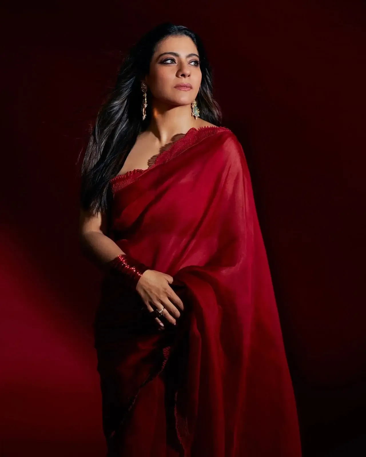 North Indian actress Kajol Devgn in Sleeveless Maroon Color saree